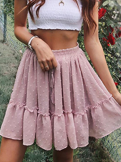 Minifalda con detalle plisado y estampado de lunares en cintura alta rosa
