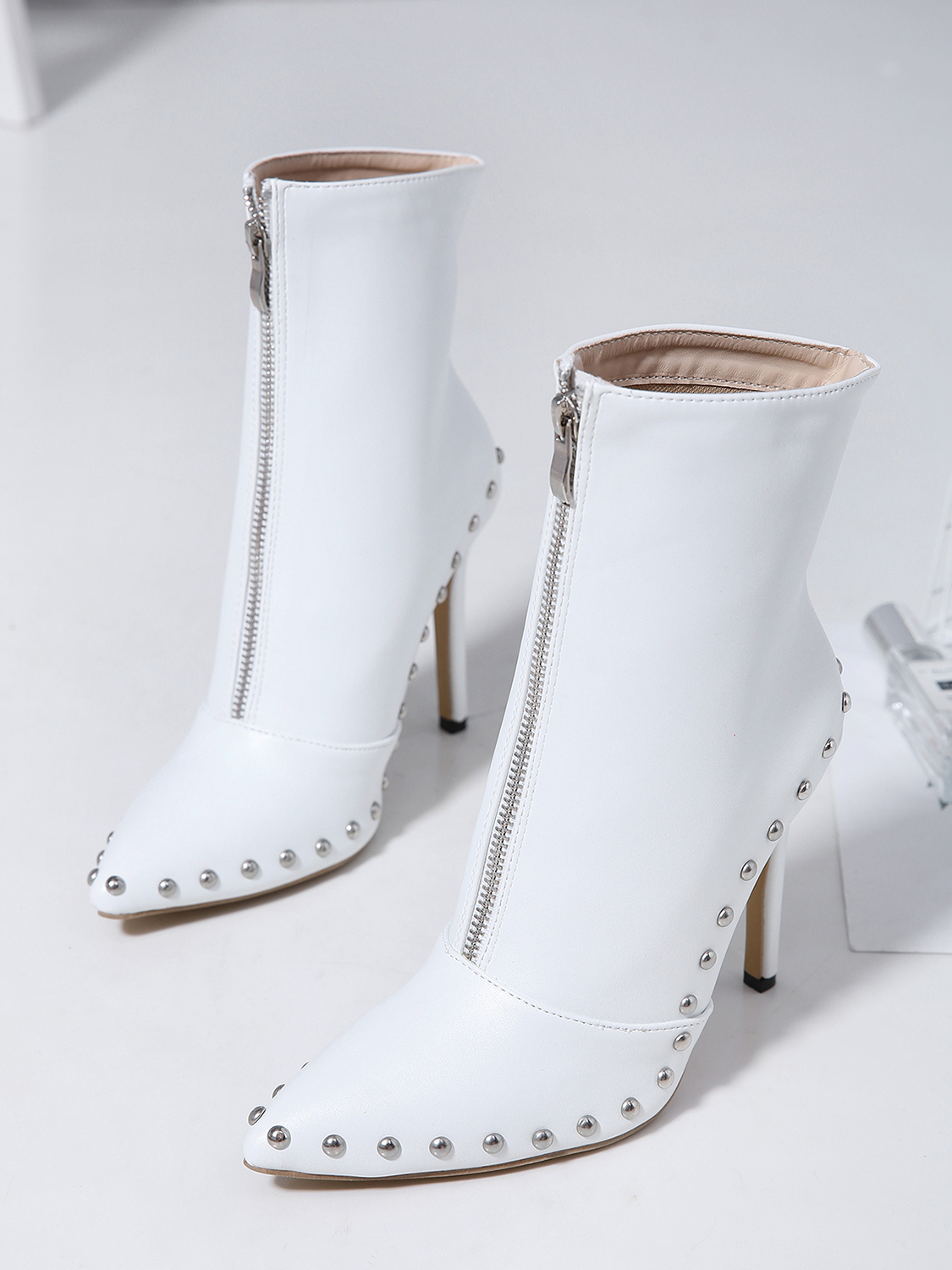 white heeled ankle boots